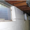 A foundation showing severe inward buckling along the windows in a Garner home.