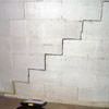A diagonal stair step crack along the foundation wall of a Thomasville home
