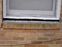 A window sill cracking and separating from the foundation wall in a Mount Airy home.