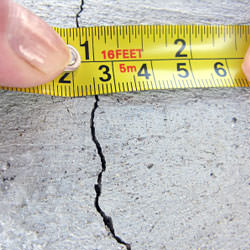 A crack in a poured concrete wall that's showing a normal crack during curing in Eden