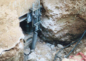 a bent, failed foundation push pier installed in Raleigh.