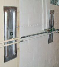 A foundation wall anchor system used to repair a basement wall in North Wilkesboro