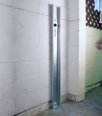 A failing foundation wall repaired with a foundation wall channel anchor system in a Cary home.