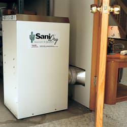 A basement dehumidifier with an ENERGY STAR® rating ducting dry air into a finished area of the basement  in Eden